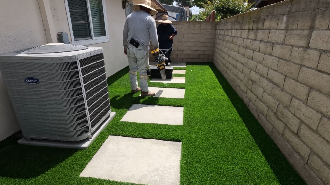 Mud-free artificial grass installation with pavers in Lehigh Acres, FL